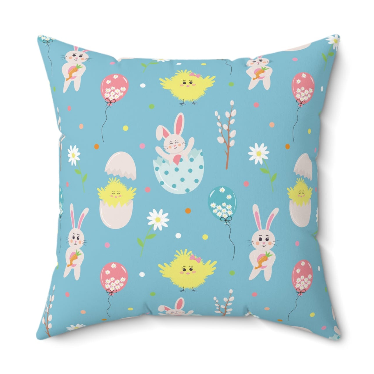 A square decorative pillow with a pattern of playful bunnies, eggs, and spring flowers on a blue background.