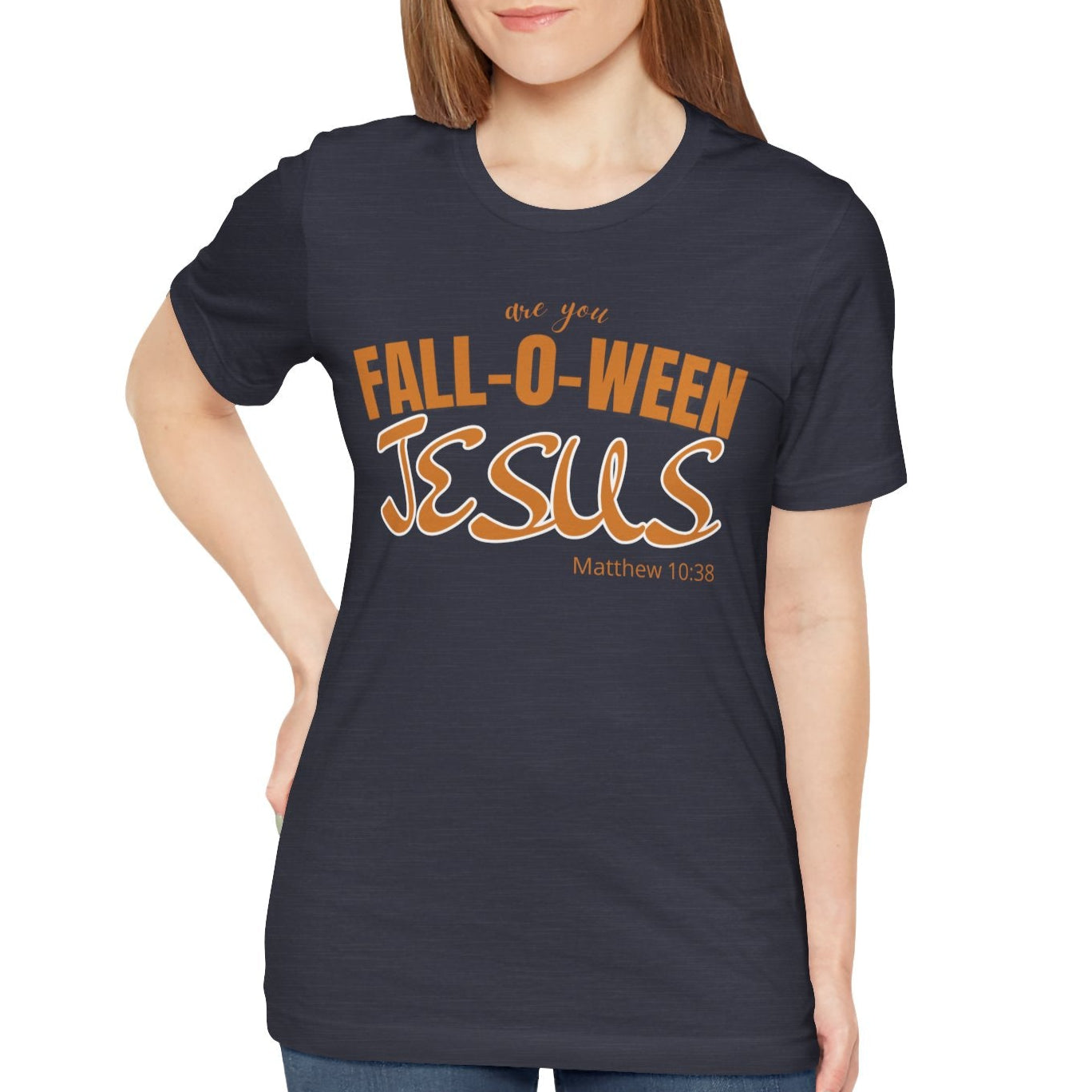 Woman wearing a navy t-shirt with 'Fall-o-ween Jesus' text on a white background