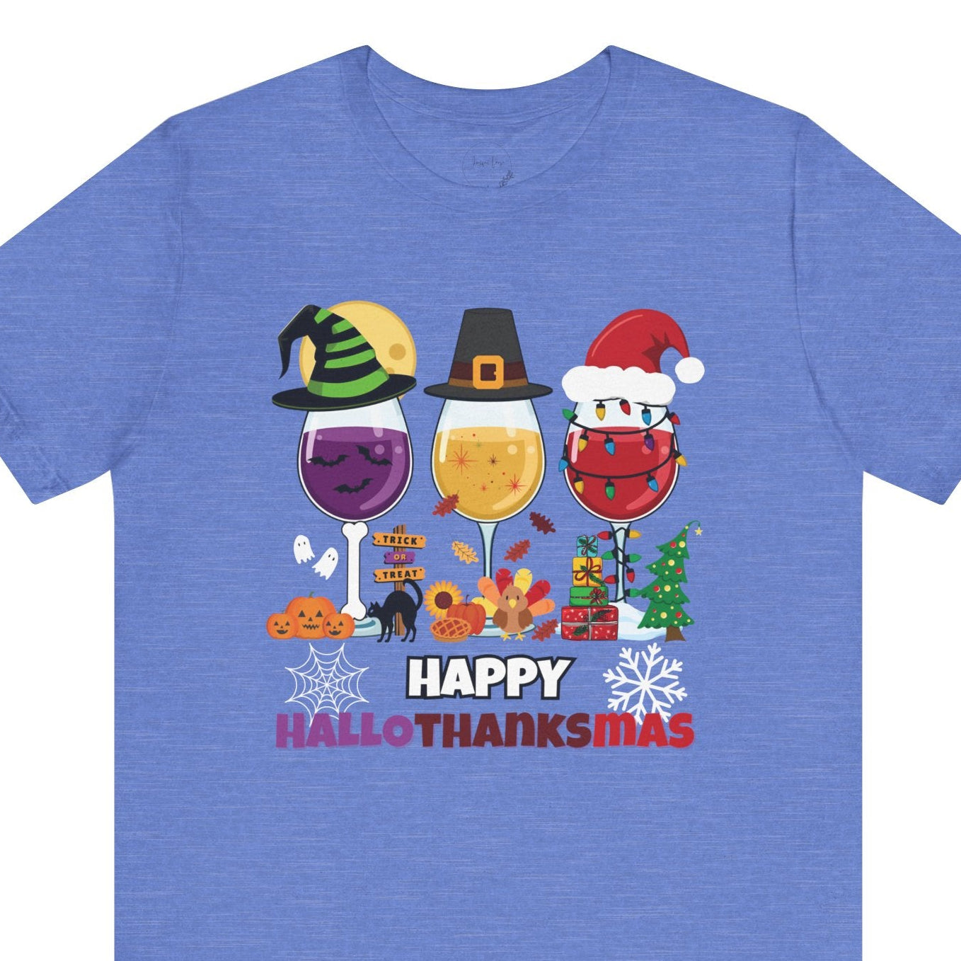 Blue t-shirt with 'Happy HalloThanksMas' design featuring wine glasses and holiday-themed characters on a white background.