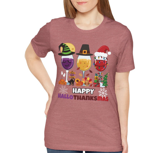 Person wearing a mauve t-shirt with 'Happy HalloThanksMas' design on a white background
