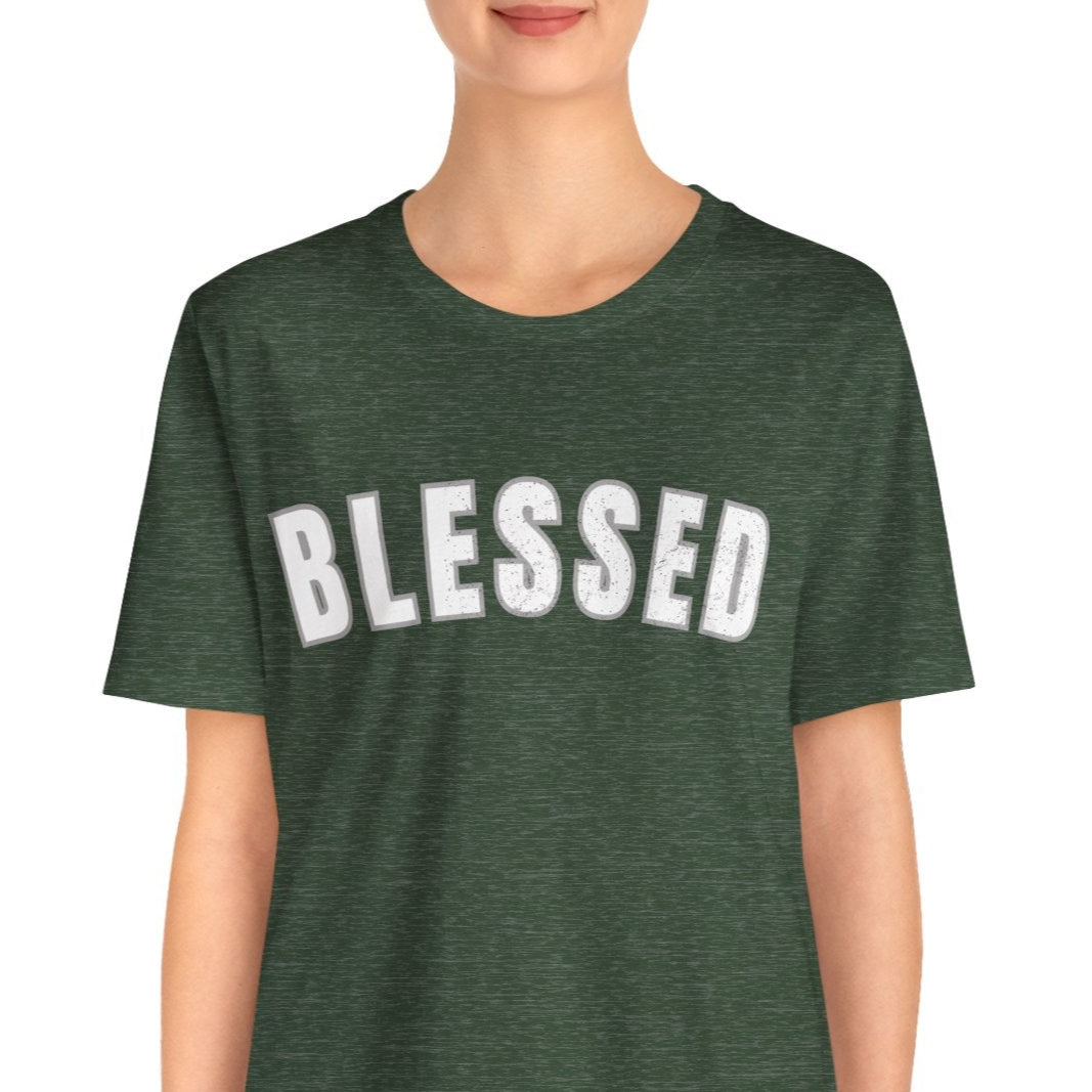 Person wearing a green t-shirt with 'BLESSED' text on a white background