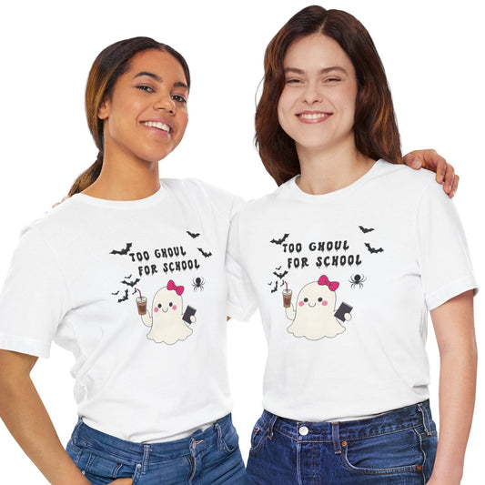 Two women wearing white t-shirts with Halloween-themed graphics and text on a white background.