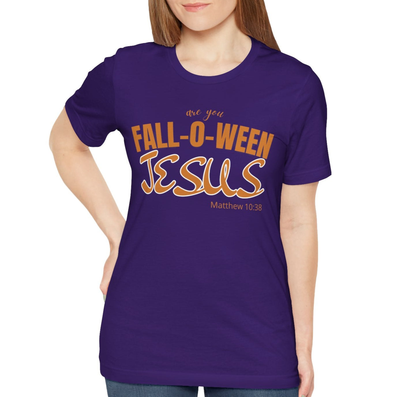 Woman wearing a purple t-shirt with 'Fall-o-ween Jesus' text on a white background