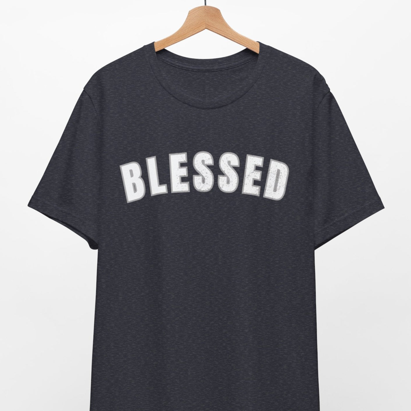 Black t-shirt with 'BLESSED' text on a hanger against a white background