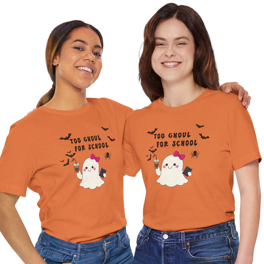 Two people wearing orange t-shirts with Halloween-themed graphics on a white background