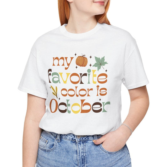 Person wearing a white t-shirt with 'my favorite color is October' text and graphics.