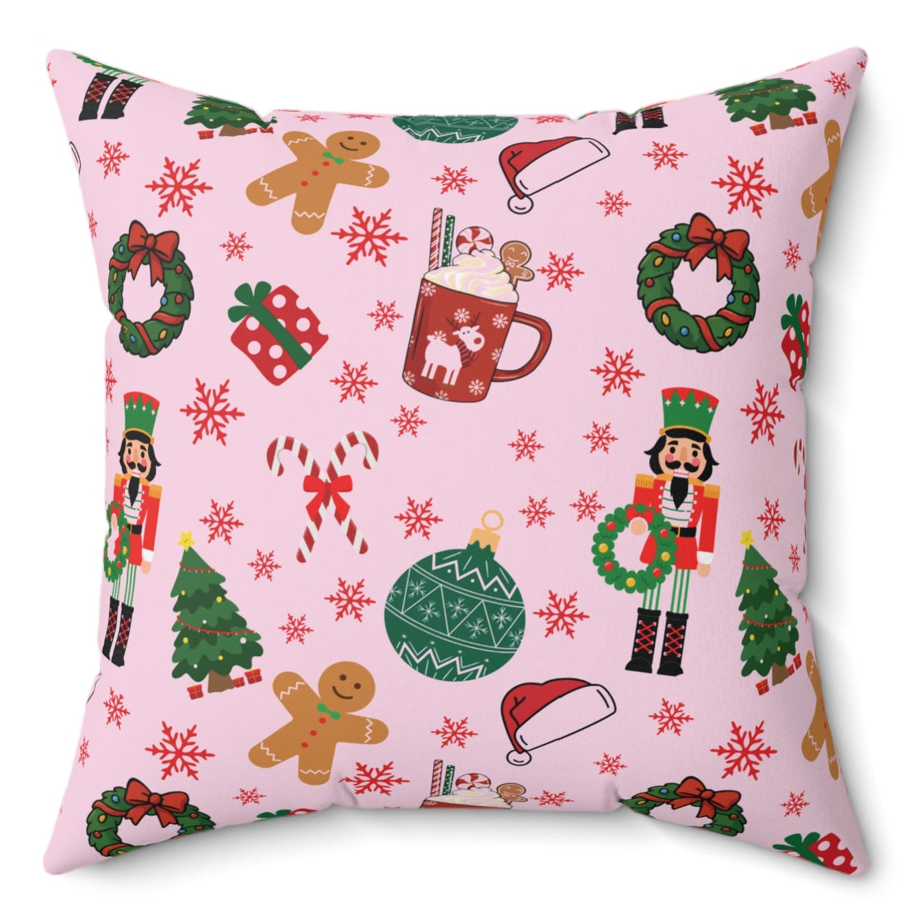 Decorative pillow with Christmas-themed pattern on a pink background