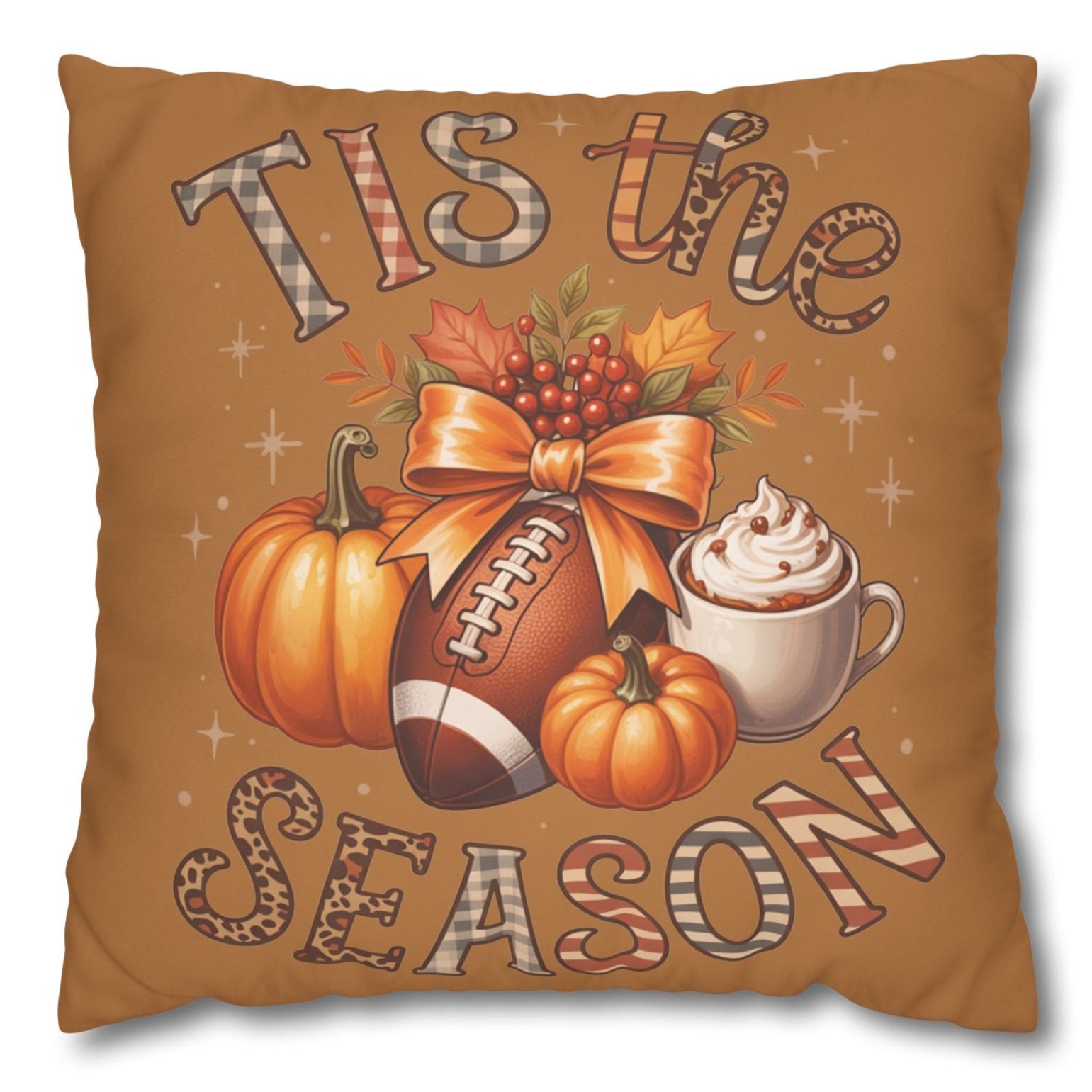Decorative pillowcase with 'Tis the Season' text, pumpkins, football, and coffee cup on a brown background.