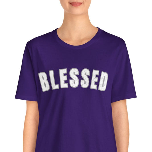 Person wearing a purple t-shirt with 'BLESSED' text standing in a white background