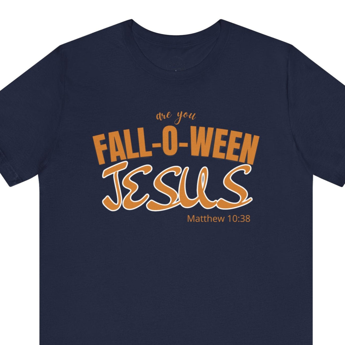 Navy blue t-shirt with 'Fall-o-Ween Jesus' text in orange on a white background