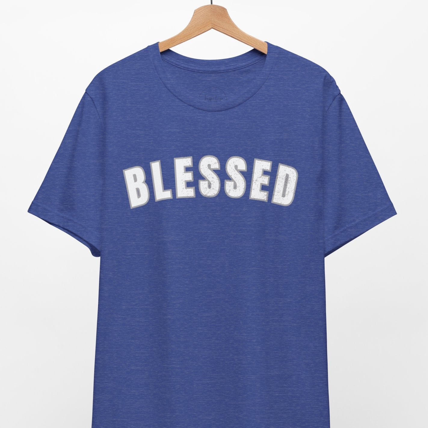 Blue t-shirt with 'BLESSED' text on a hanger against a white background