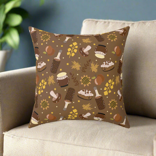 Brown autumn pillow with cozy fall treats and leaves pattern on beige sofa for seasonal home decor.