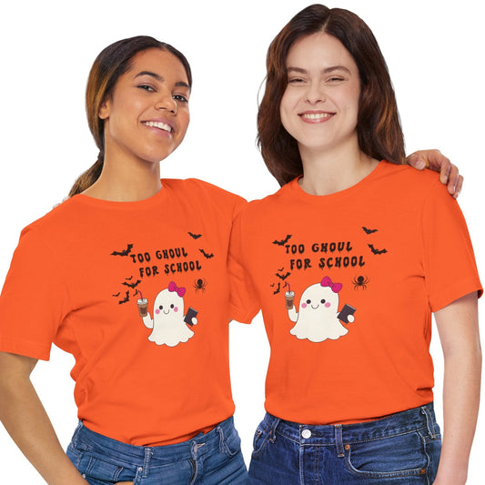 Two people wearing orange t-shirts with Halloween-themed graphics on a white background