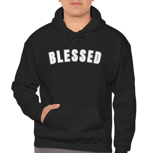 Man wearing a black hoodie with 'BLESSED' text on a white background