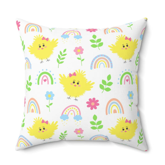 Decorative pillow with yellow chicks, rainbows, and flowers on a white background