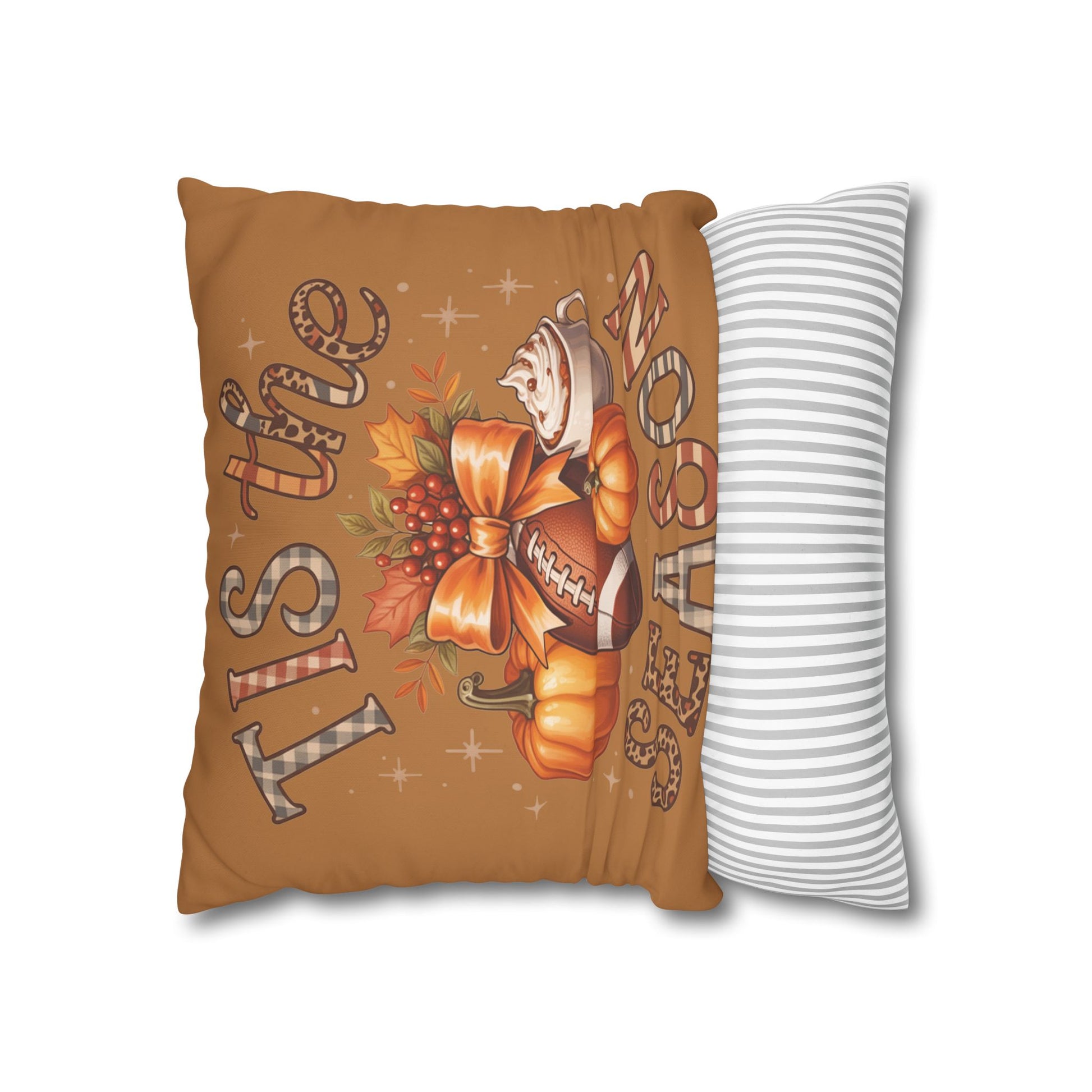 Decorative pillow with autumn-themed design and striped pillow next to it on a white background