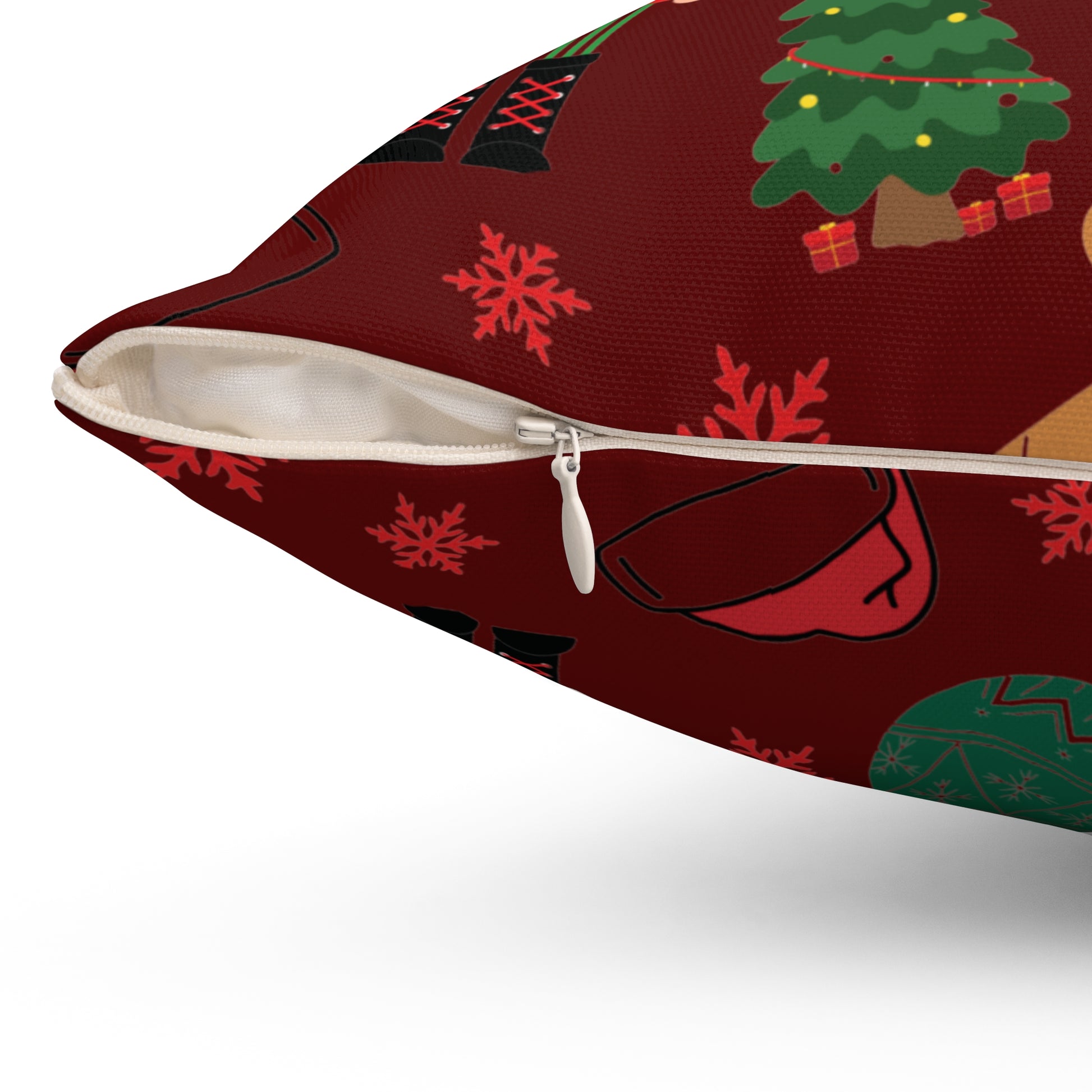 Dark Red Pillow with Christmas-themed design featuring trees, presents, and snowflakes on a red background. Close-up of the zipper.