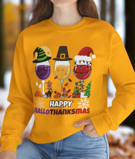 Person wearing a green sweatshirt with 'Happy HalloThanksMas' design, sitting on a white surface with a plant in the background.