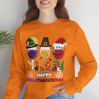 Person wearing an orange sweatshirt with 'Happy HalloThanksMas' design, sitting on a white surface with a plant in the background.