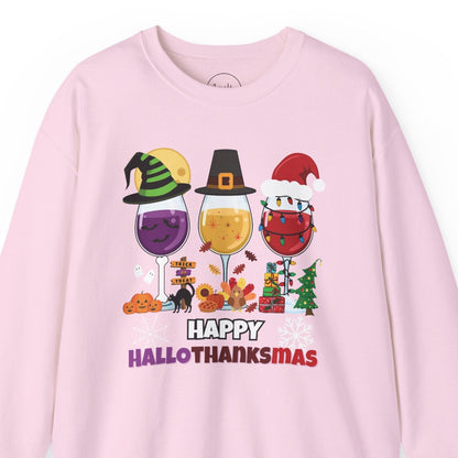 Pink sweatshirt with 'Happy HalloThanksMas' design featuring Halloween and Thanksgiving elements on a white background.