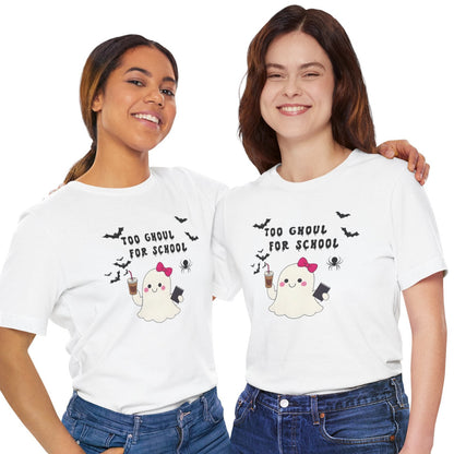 Two women wearing white t-shirts with Halloween-themed graphics and text on a white background.