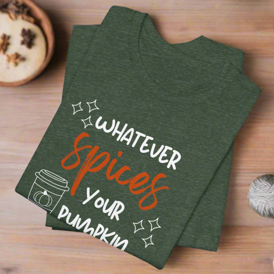 Green t-shirt with 'Whatever Spices Your Pumpkin' text on a wooden surface