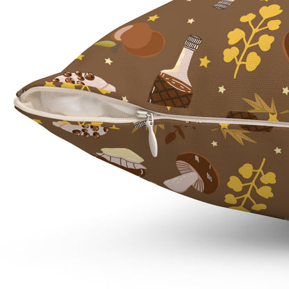 Close-up of brown fall pillow showing white zipper and detailed autumn dessert and leaf print design.