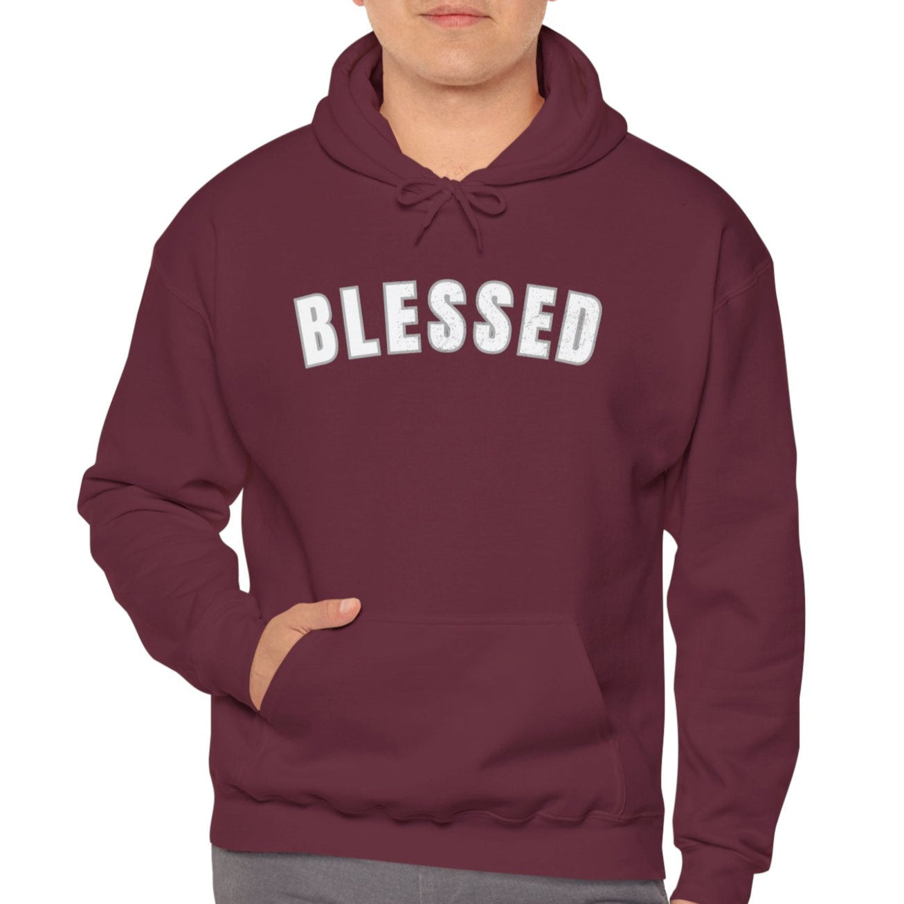 Man wearing a maroon hoodie with 'BLESSED' text on a white background