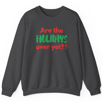 Dark gray sweatshirt with red and green text that says "Are the holidays over yet?" on a white background