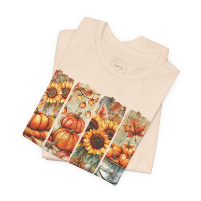 Beige t-shirt with autumn-themed design on a white background