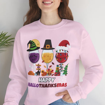 Person wearing a pink sweatshirt with 'Happy Hall-O-THANKSMAZ' design, sitting on a white surface with a plant in the background.