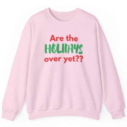 Pink sweatshirt with text 'Are the holidays over yet??' on a white background