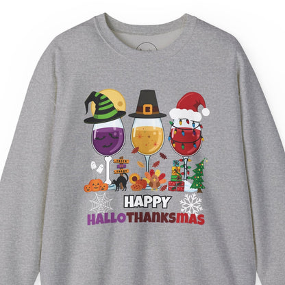 Gray sweatshirt with 'Happy HalloThanksMas' design featuring wine glasses and holiday elements on a white background.