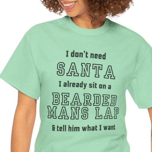 Person wearing a light green t-shirt with humorous text design on a white background