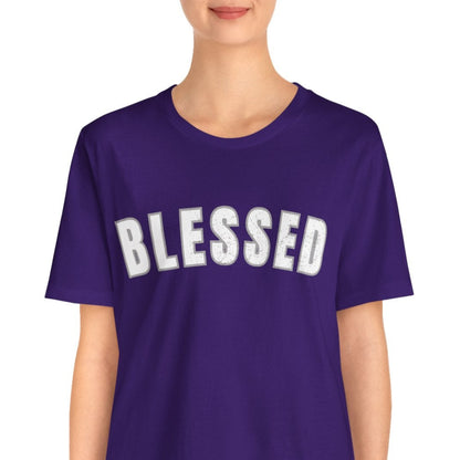 Person wearing a purple t-shirt with 'BLESSED' text standing in a white background