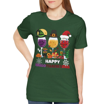 Person wearing a green t-shirt with festive designs and text Happy HallowThanksMas on a white background