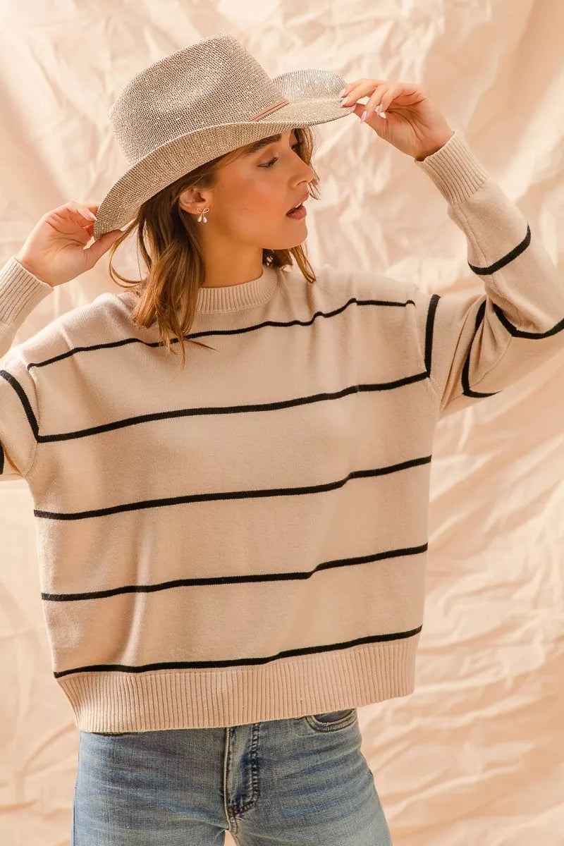 Striped crew neck sweater top in neutral tones with a classic fit, perfect for layering or everyday casual wear.