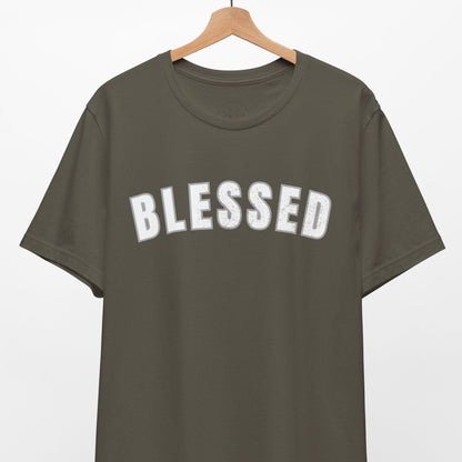 Green t-shirt with 'BLESSED' text on a hanger against a white background