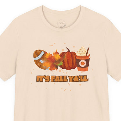 Beige t-shirt with autumn-themed graphics and text on a white background