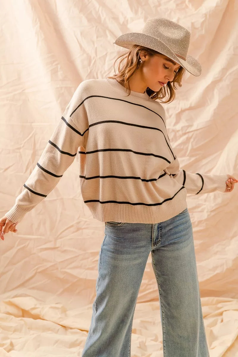 Striped crew neck sweater top in neutral tones with a classic fit, perfect for layering or everyday casual wear.