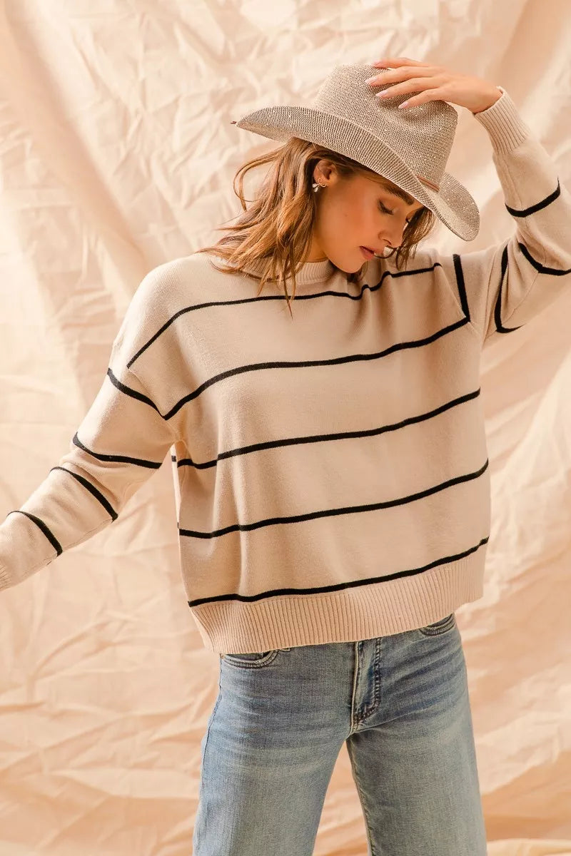 Striped crew neck sweater top in neutral tones with a classic fit, perfect for layering or everyday casual wear.