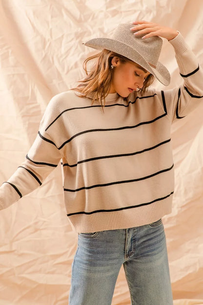 Striped crew neck sweater top in neutral tones with a classic fit, perfect for layering or everyday casual wear.
